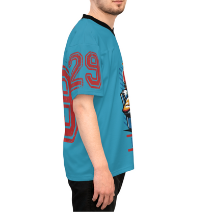 Person wearing a blue t-shirt with red numbers and graphics on a white background
